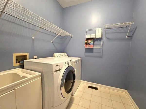 a utility room with dryer and washer