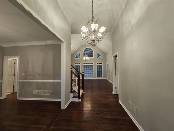a view of a livingroom with wooden floor