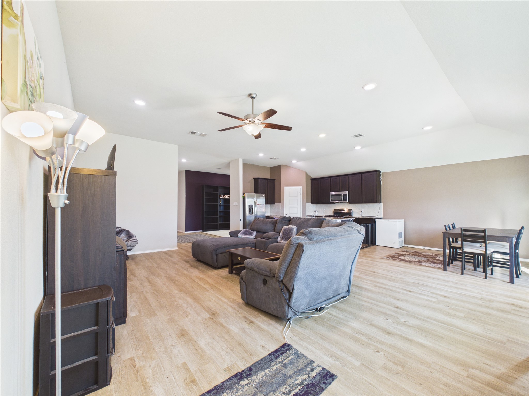 1237 Steed Bluff Drive Alvin, TX 77511 - Photo 12 of 50 a living room with furniture kitchen view and a refrigerator