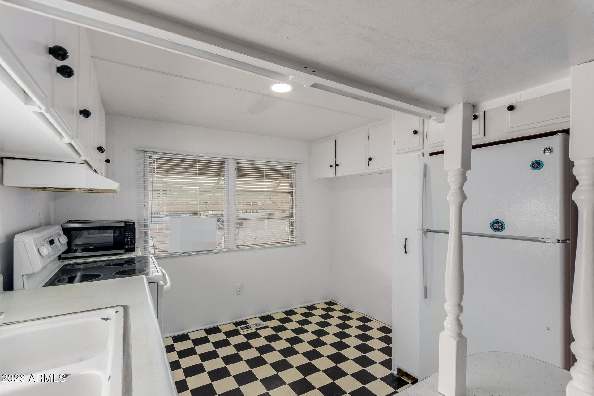 2434 East Main Street, Unit 123 Mesa, AZ 85213 - Photo 14 of 29 a kitchen with a refrigerator and a stove