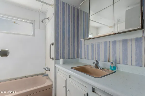 a bathroom with a shower and a window