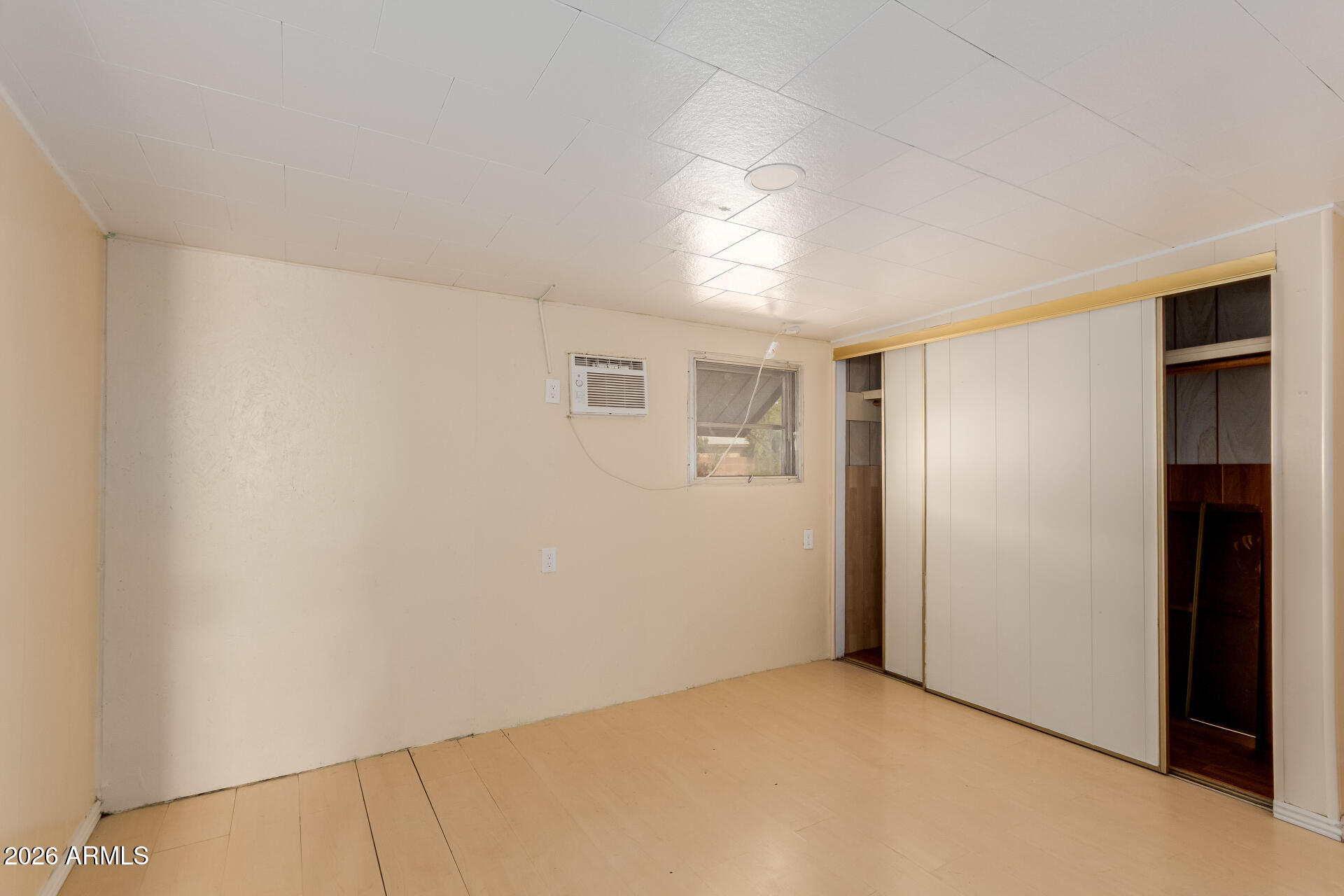 2434 East Main Street, Unit 123 Mesa, AZ 85213 - Photo 26 of 29 a view of an empty room with a window
