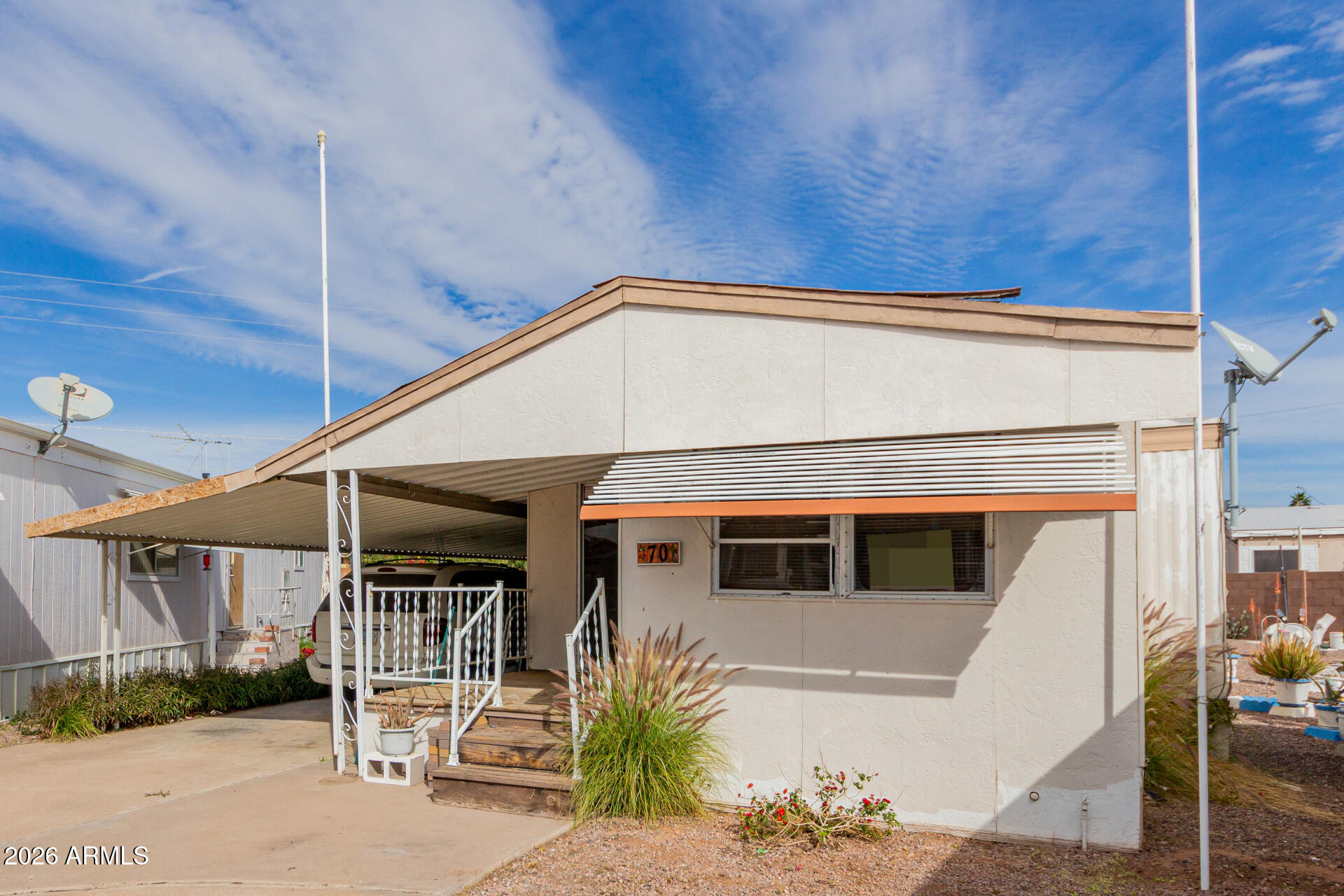 2434 East Main Street, Unit 123 Mesa, AZ 85213 - Photo 6 of 29 a front view of a house with garden