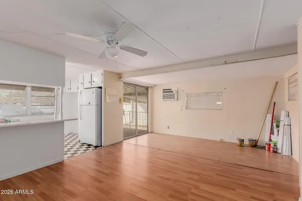 a view of a kitchen with wooden floor