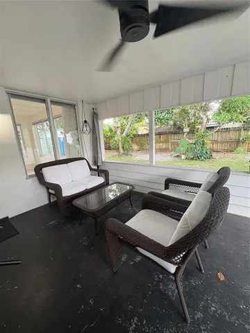 a view of a livingroom with furniture and window