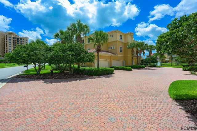 a view of a street with a building in the background