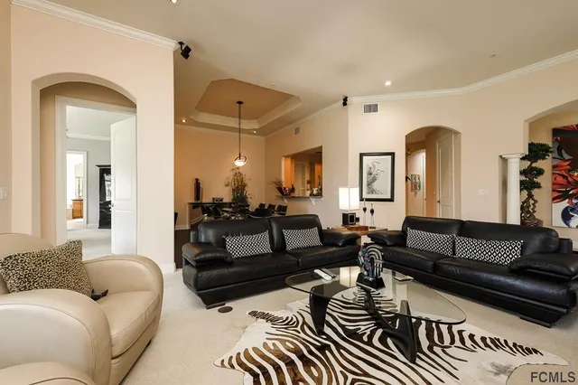 a living room with furniture or couch and a mirror