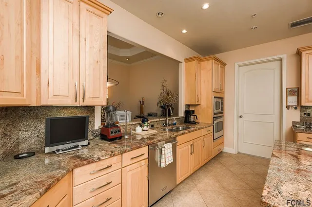 a spacious bathroom with a granite countertop sink and a mirror