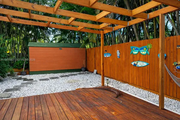 a backyard of a house with a shaded area