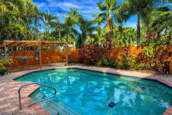 a view of swimming pool from a garden