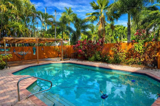 a view of swimming pool from a garden