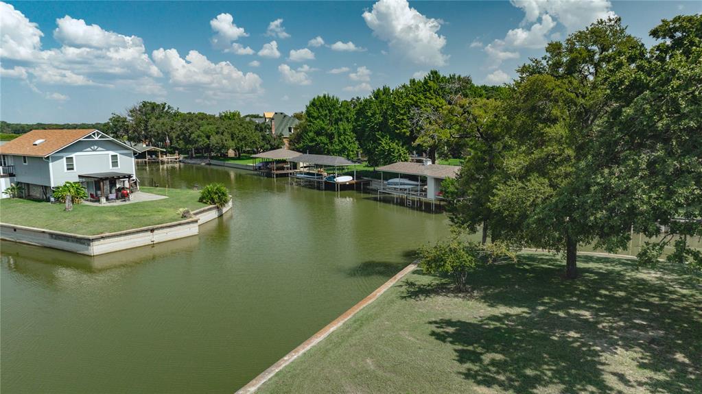 504 Harbor Drive South Azle, TX 76020 - Photo 8 of 25 a view of a lake with a house