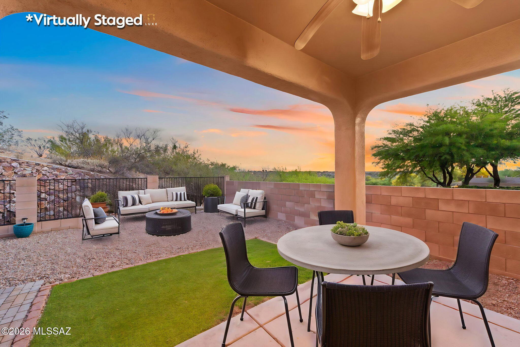 13668 East High Plains Ranch Street Vail, AZ 85641 - Photo 3 of 51 a view of a patio with lawn chairs couches and potted plants