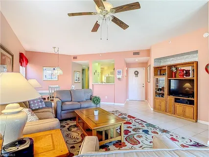 a living room with furniture and a rug