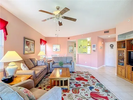 a living room with furniture and a rug