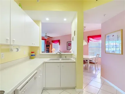 a kitchen that has a sink and cabinets in it