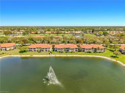 an aerial view of residential building with ocean view
