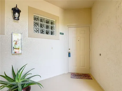 a view of a hallway with paintings on the wall