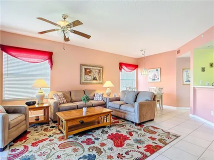 a living room with furniture and a rug