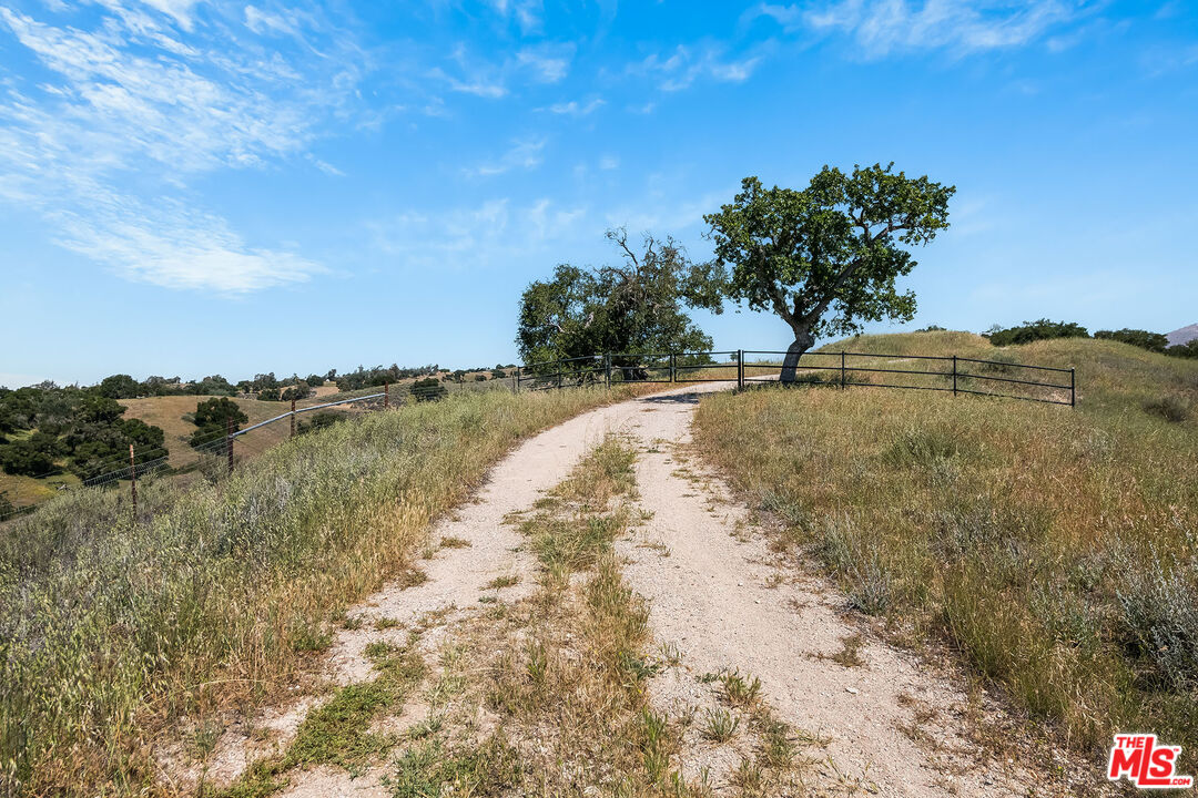 3349 Long Valley Road Santa Ynez, CA 93460 - Photo 2 of 22 a view of a lake with a yard