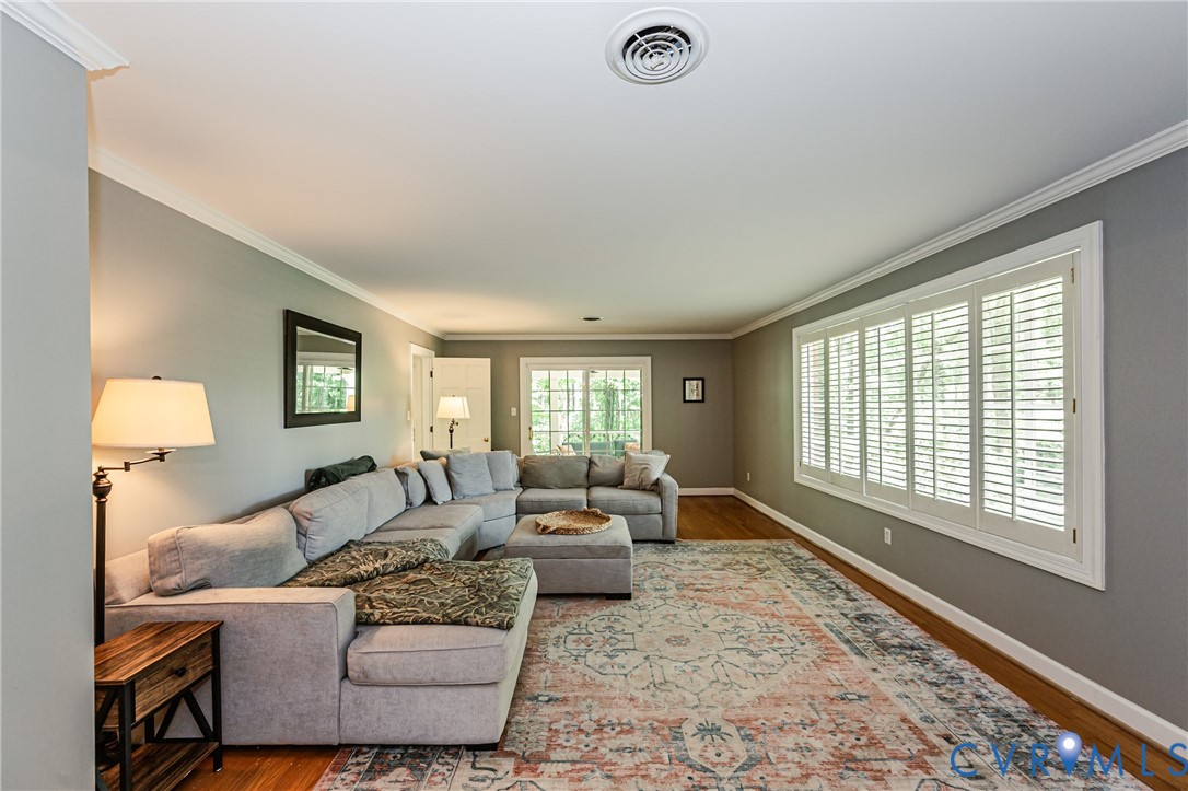 15611 Robert Terrell Road Montpelier, VA 23192 - Photo 2 of 28 Living area featuring hardwood flooring, crown mol