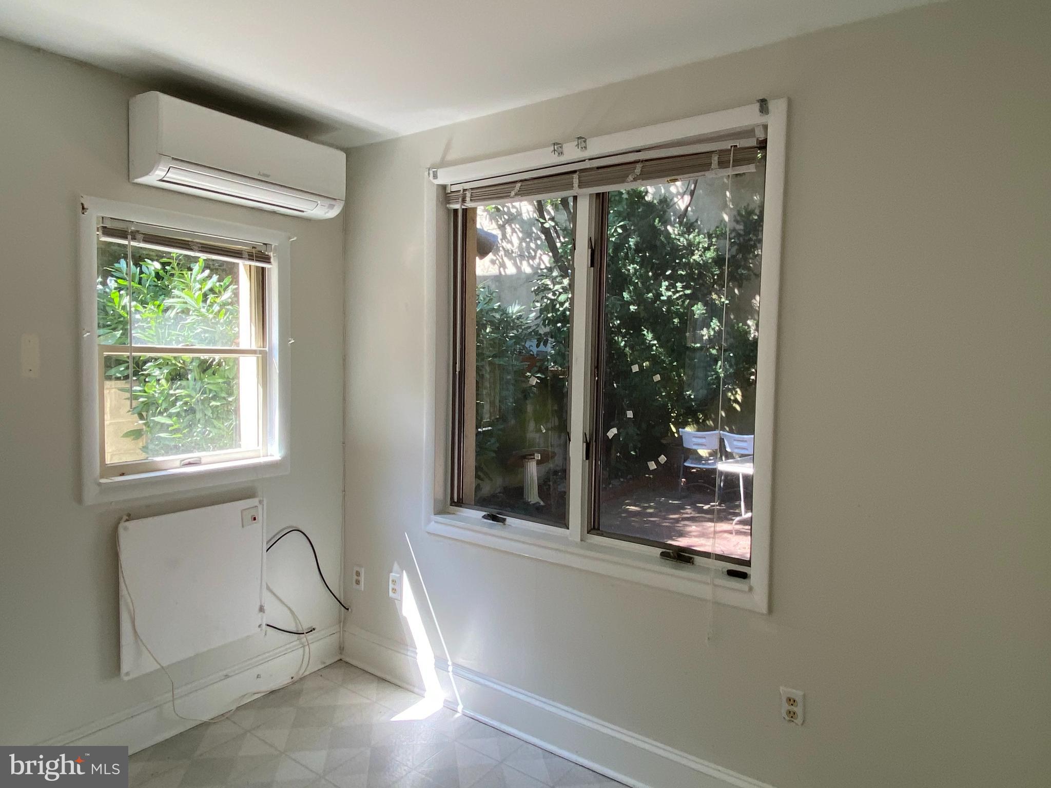 790 South Front Street Philadelphia, PA 19147 - Photo 4 of 12 a bath tub sitting in a bathroom next to a window