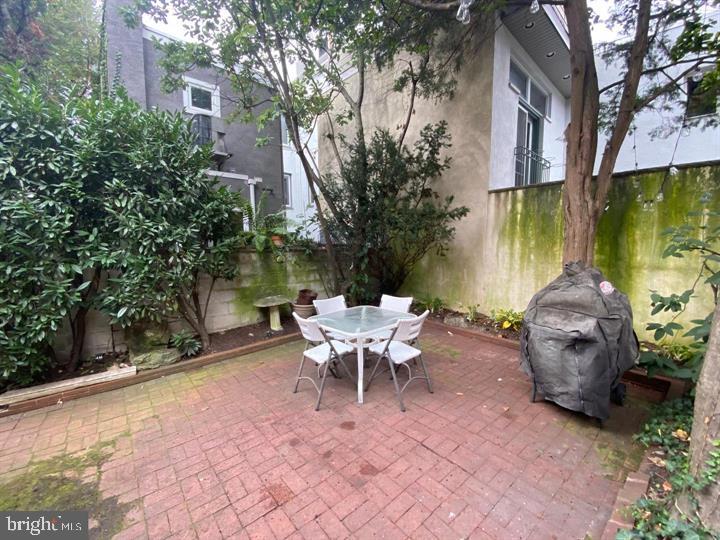 790 South Front Street Philadelphia, PA 19147 - Photo 10 of 12 a backyard of a house with table and chairs