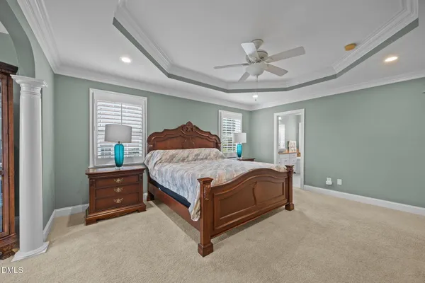 a living room with furniture stairs and a window