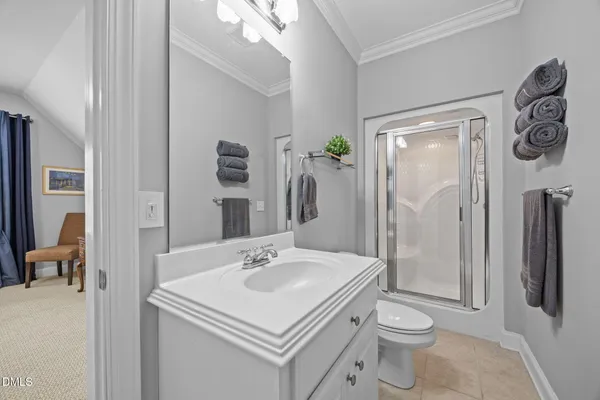 a view of a hallway with wooden floor and windows