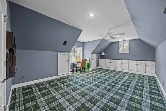 a view of a patio with table and chairs potted plants with wooden floor