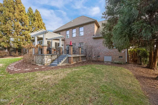 a view of a chairs and table in patio with wooden floor