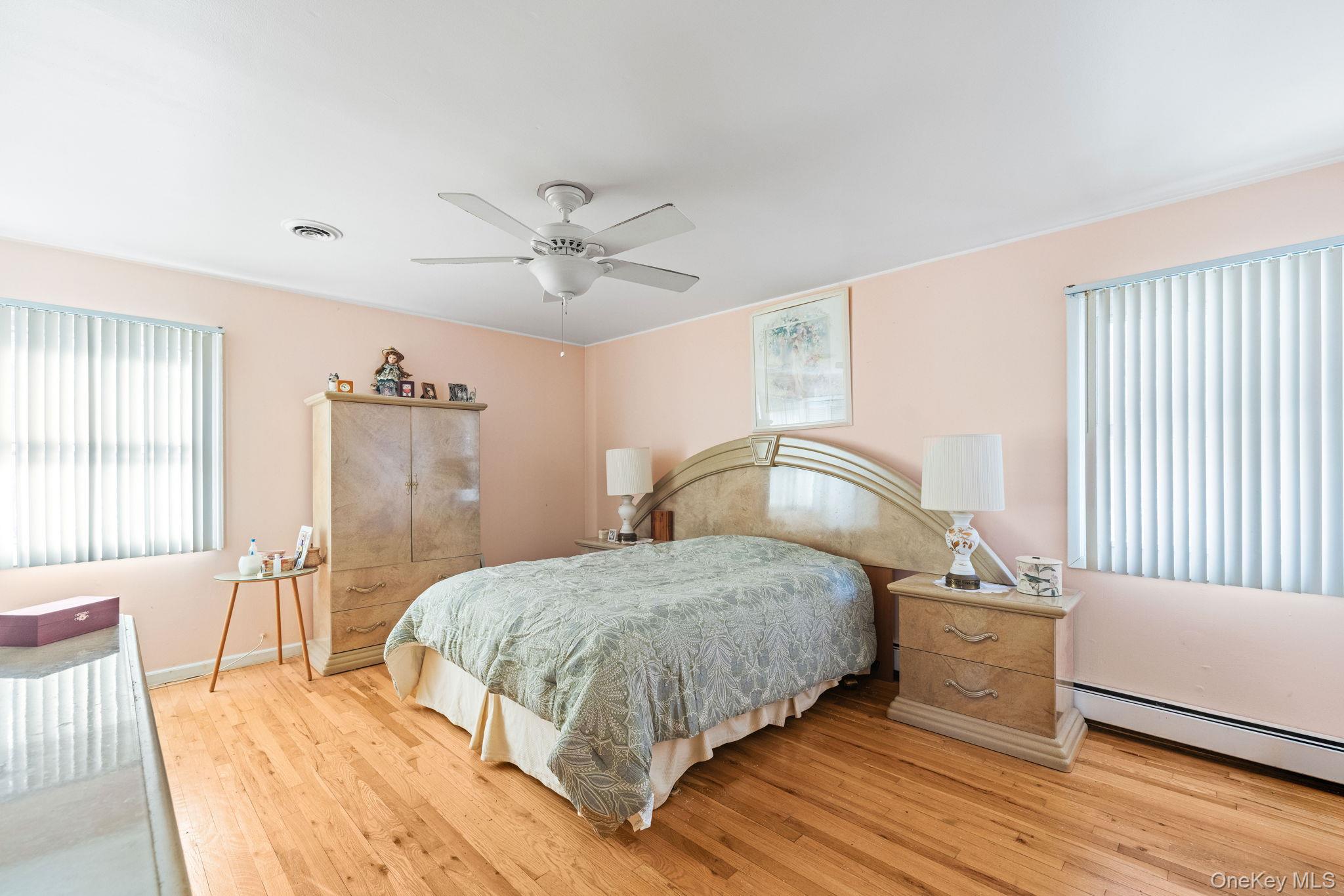 38 Haller Crescent Spring Valley, NY 10977 - Photo 13 of 24 12x16 Primary bedroom with hardwood floors, walk in closet