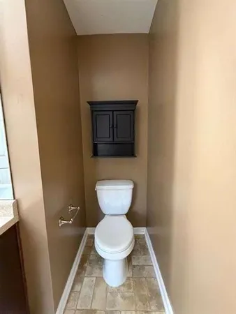 a bathroom with bathtub and window