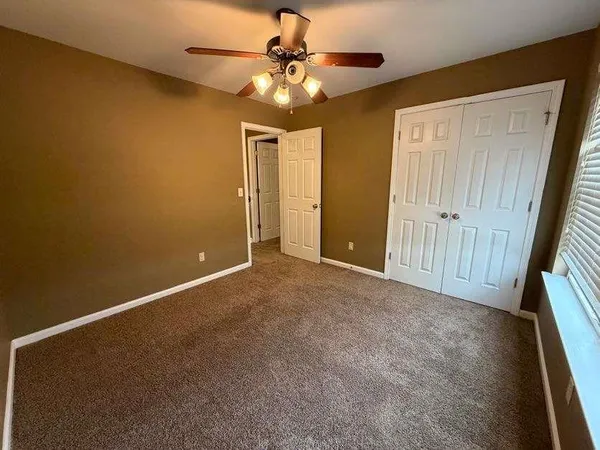 a view of a hallway with staircase