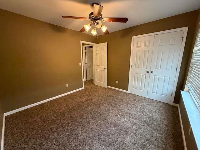 a view of a hallway with staircase