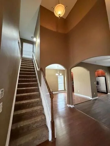 wooden floor in an empty room with a fireplace