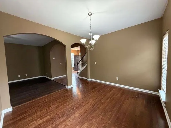 a kitchen with stainless steel appliances a refrigerator and a stove top oven