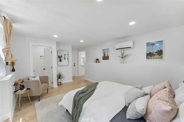 a bedroom with a bed and a couch