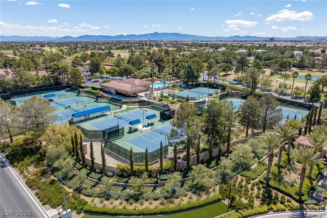 20 Innisbrook Avenue Las Vegas, NV 89113 - Photo 35 of 39 An aerial perspective reveals numerous tennis courts nestled amidst lush landscaping and community amenities.