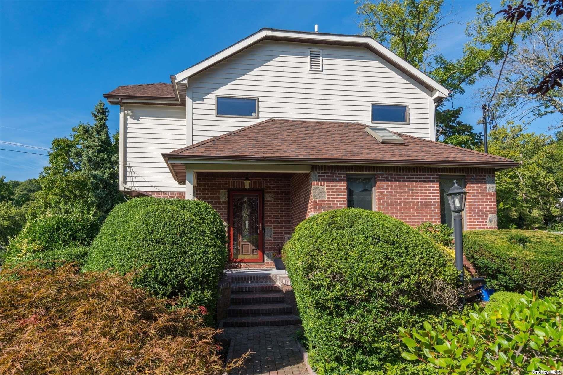7 Portland Place Cold Spring Harbor, NY 11724 - Photo 1 of 1 a front view of a house with garden