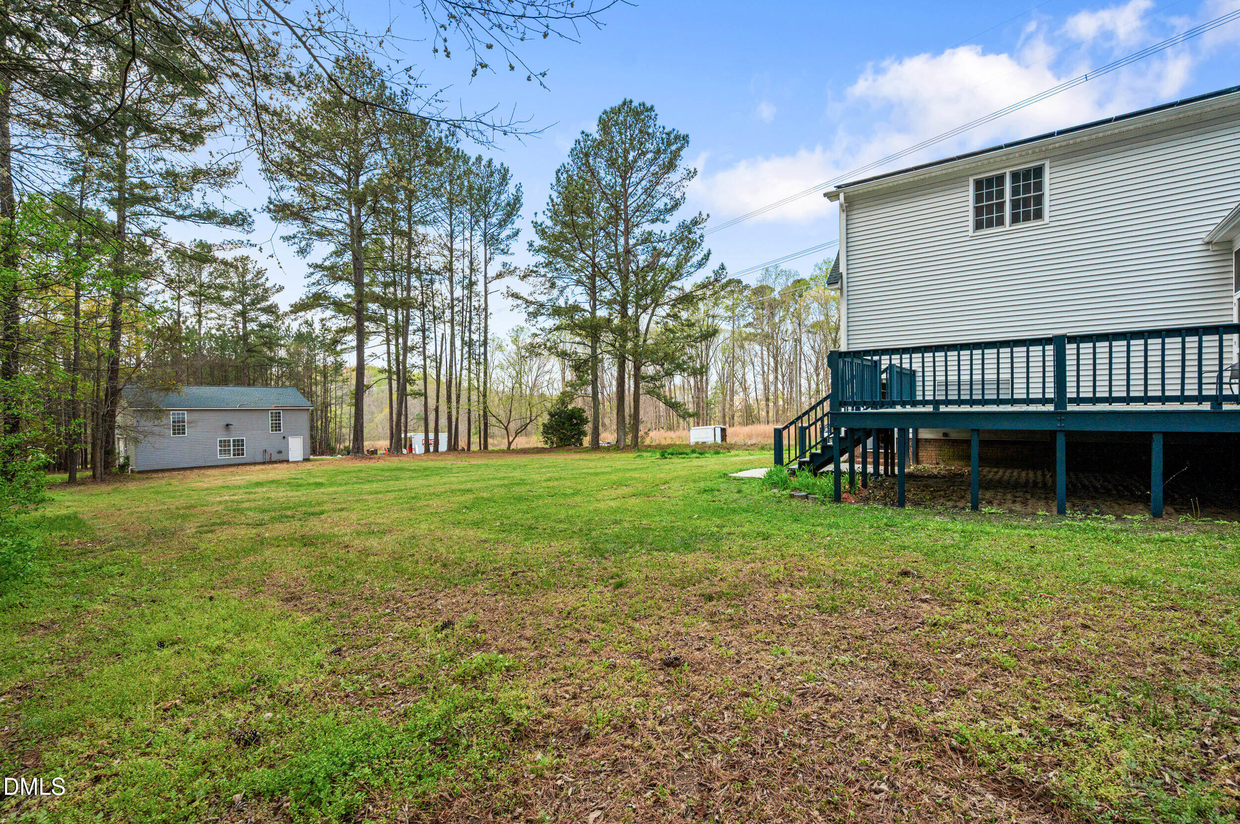 1957 Hilltop Road Raleigh, NC 27610 - Photo 36 of 46 a view of a house with backyard and a sitting area