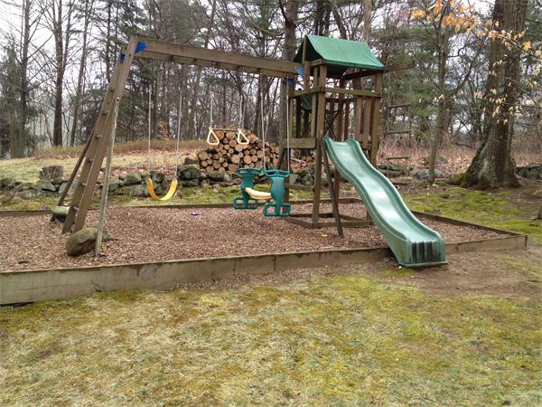 500 Marrett Road Lexington, MA 02421 - Photo 14 of 16 a view of a wooden deck with a slide
