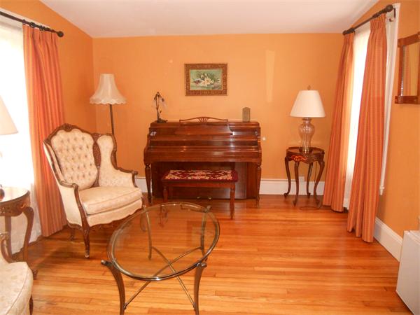 500 Marrett Road Lexington, MA 02421 - Photo 3 of 16 a living room with furniture and a lamp