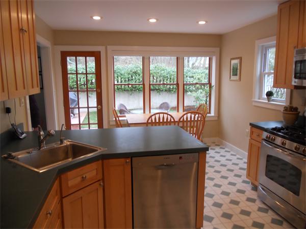 500 Marrett Road Lexington, MA 02421 - Photo 7 of 16 a kitchen with a sink stove and cabinets