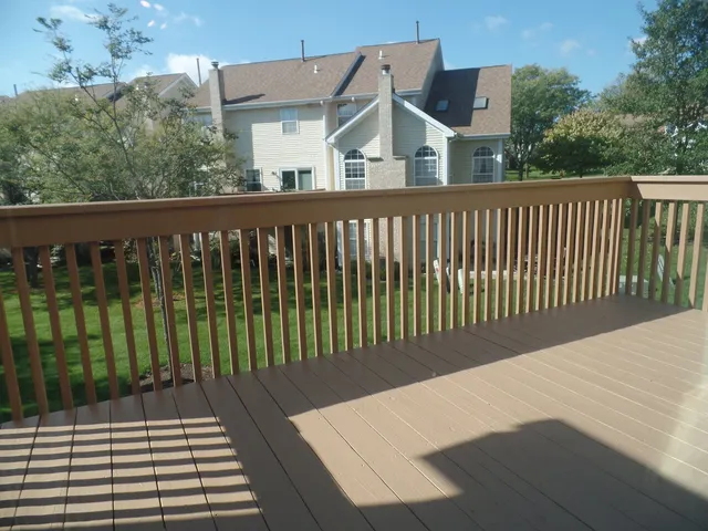 a view of a brick house with a large window