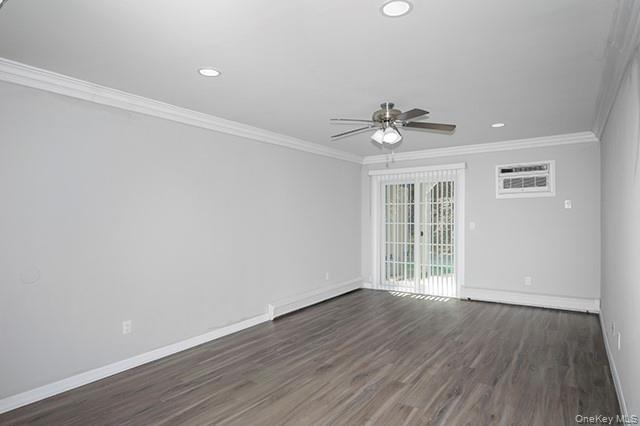 384 Cassa Loop, Unit 384 Holtsville, NY 11742 - Photo 6 of 14 wooden floor in an empty room with a window