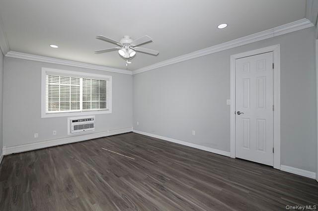 384 Cassa Loop, Unit 384 Holtsville, NY 11742 - Photo 10 of 14 a view of an empty room with wooden floor and a window