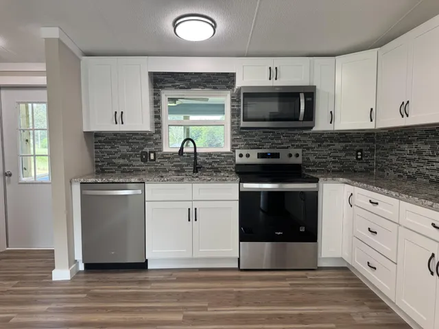 a kitchen with a stove and a microwave