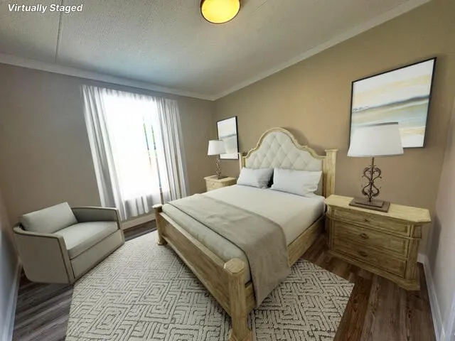 a bedroom with bed and a couch