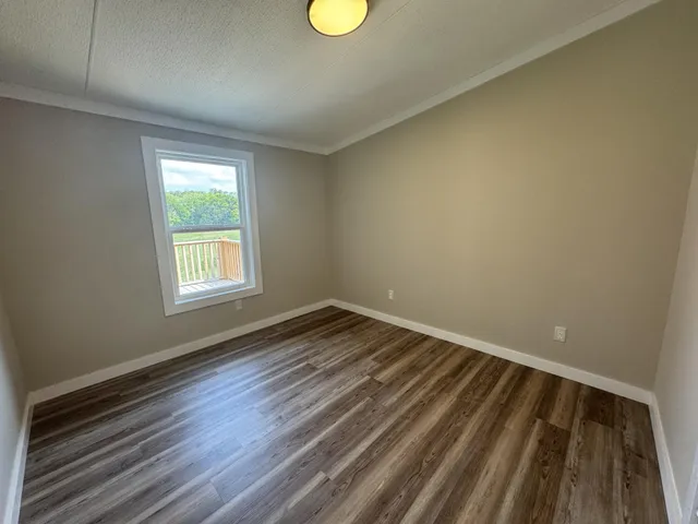 a view of an empty room and window